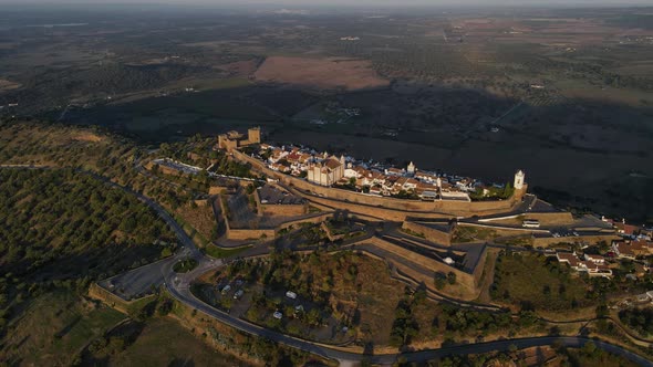 Monsaraz village in rural landscape at sunrise, Portugal. Aerial drone view alt