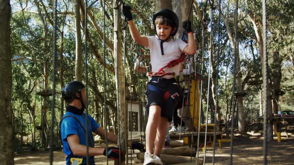 Kids walking on the logs alt