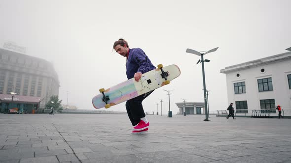 Close Up of Young Man Professional Skater Rides Skateboard or Longboard Swerves and Sways with Flow alt