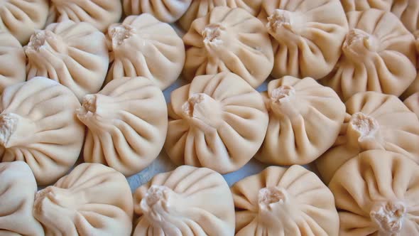 Khinkali on the Table to Sculpt to Cook alt