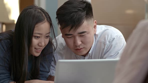 Asian Couple with Laptop alt