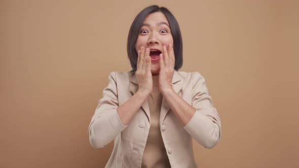 Asian business woman happy smiling and excited looking at camera isolated