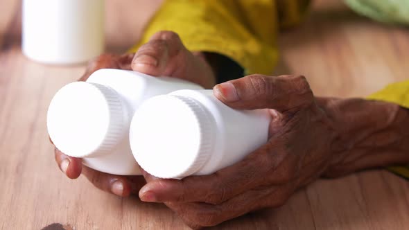 Senior Women Hand Holding Many Medicine Pill Container White Sited alt