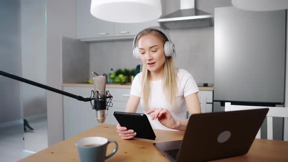 Female Streamer Makes a Live Podcast for Social Networks Remotely Working While Sitting in the alt