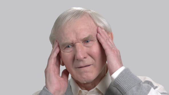 Caucasian Pensioner Feeling Pain in His Temples alt