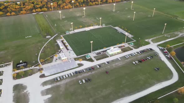 Spinning aerial of a sports and soccer complex.  Tournament and practice fields are visible below alt