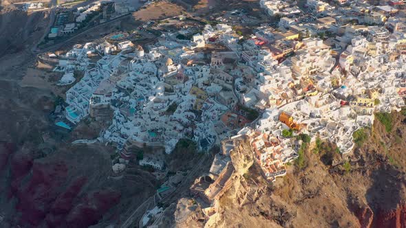 Aerial shot of famous Oia village in Santorini at sunrise in Greece
