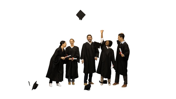 Graduation Caps Are Tossed Into The Air By A Happy Group alt