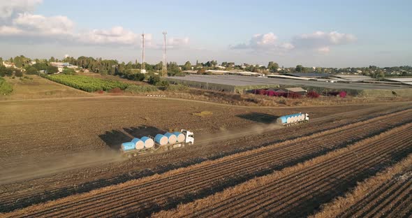 Aerial view of lorries in a cotton field, Israel. alt