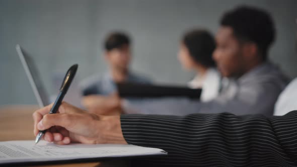 Closeup Female Hand Holds Pen Unrecognizable Girl Makes Notes on Sheet of Paper Sign Document alt