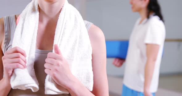 Portrait of woman standing with towel alt