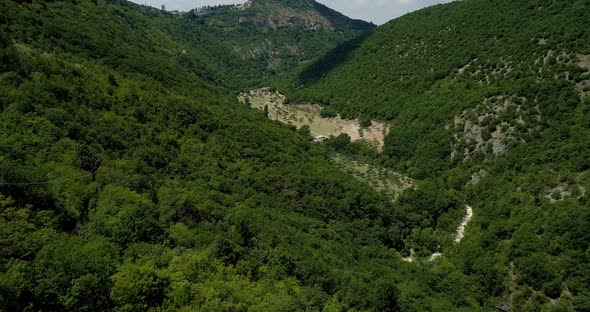 Aerial View Flying Above Rural Town or Village or City of Assisi Castle. Approaching Discovering alt