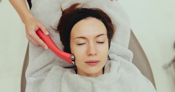 Woman Receiving a Facial Massage alt