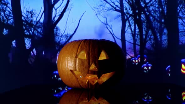 Scarry halloween pumokin in the woods alt