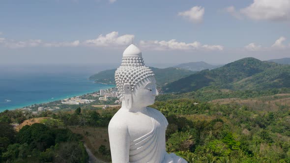 White Buddha Statue in Thailand Standing on the Top of Mountain