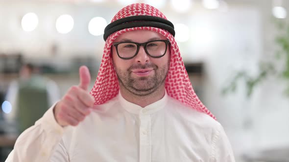 Positive Young Arab Businessman Doing Thumbs Up  alt