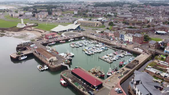Drone View of the Boat Stop with the Town and the Sea in the Background