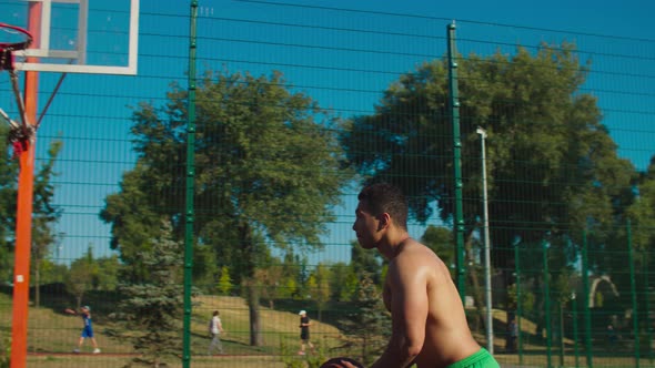 Streetball Player Setting Up Alley-oop for Teammate alt