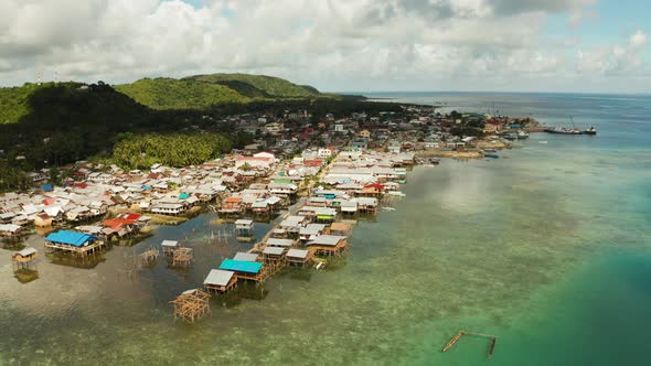 Fishing Village and Houses on Stilts. Dapa City, Siargao, Philippines alt