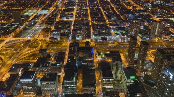 Time-lapse of car traffic and city building at night in Chicago city downtown. alt