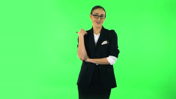 Beautiful Girl Is Reporting and Tells a Lot of Interesting Informations. Green Screen alt