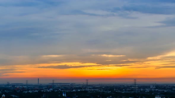 Time lapse sunset sunrise and beautiful twilight fluffy storm cloudy blue and yellow sky alt