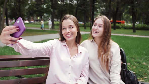 Lesbian couple making video chat with family and friends. Happy couple. Video conferencing. alt
