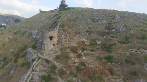 Drone View of the Steep Cliffs and the Remains of a Destroyed Fortress alt