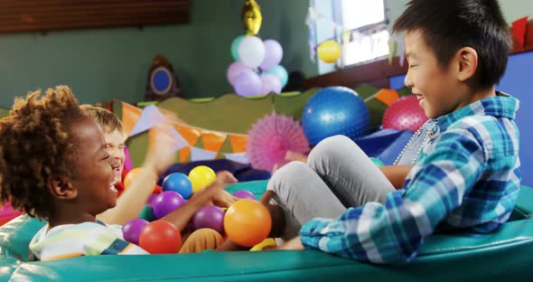Kids playing together in ball pool 4k alt