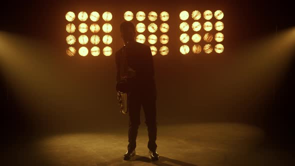 Saxophonist Playing Instrument Passionately on Stage alt