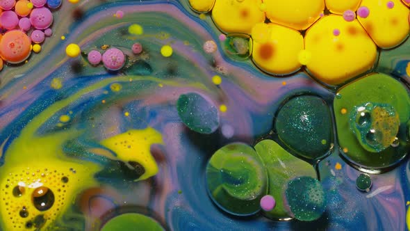 Yellow Neon Colorful Bubbles Oil and Ink Acrylic Paint Moving Closeup Wallpaper Background alt