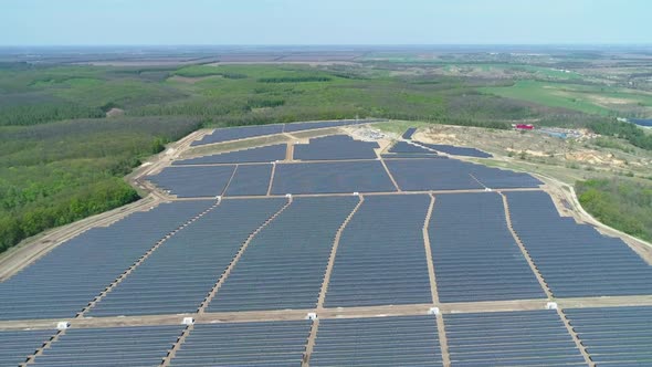 Aerial View of Solar Power Station Field at Sunny Day. Aerial Top View of Solar Farm. Renewable alt