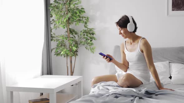 Woman Listening Music in Morning