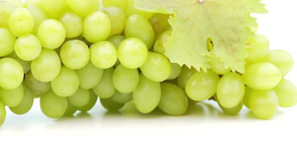 Green Grapes Rotating on White Close