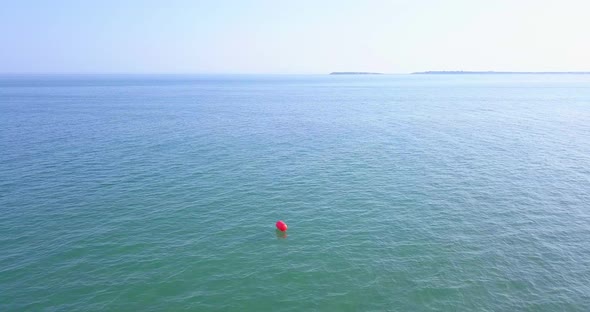 Aerial Drone View of Lonely Buoy in the Sea