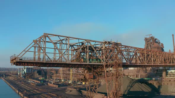 Cranes for Loading at an Industrial Plant Standing at Sea alt
