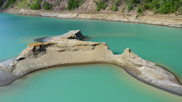 Drone View of the Turquoise Lake Formed As a Result of Mining Waste alt