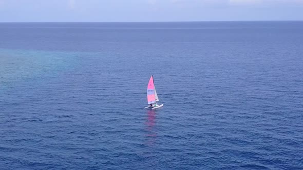 Aerial seascape of tourist beach by blue ocean and sand background alt