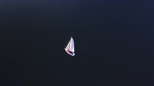  Aerial Shot of a Yacht Sailing in a Lake