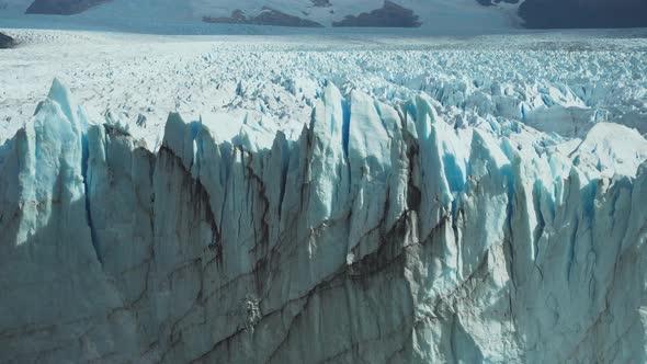 Panning right shot of endless spikes of ice on Perito Moreno Glacier alt