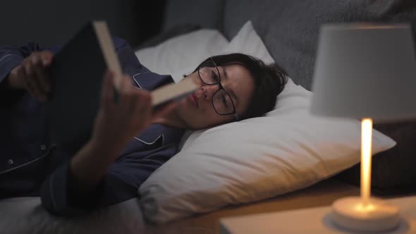 Woman Reading Before Sleep