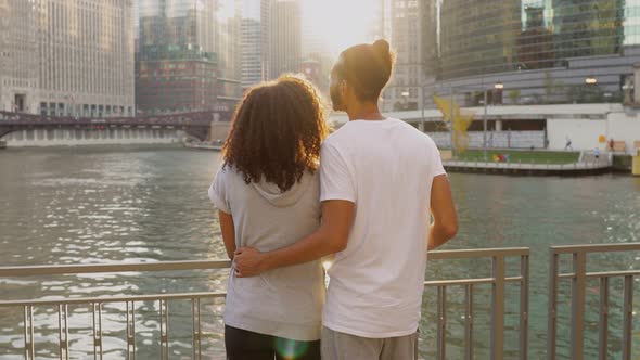 Cute African American couple take a break along after their workout alt