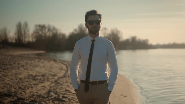 Man Resting On Nature Breathing Fresh Air. Businessman In Sunglasses Enjoy Stress Free Peaceful. alt
