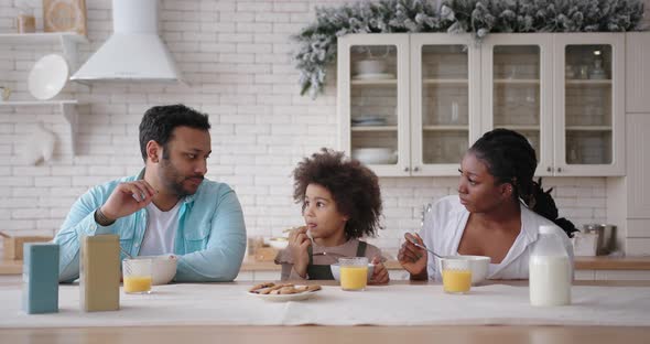 Multinational Family Eats Cookies and Cereal for Breakfast alt