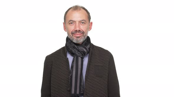 Headshot of Mature 50s Senior with Grey Beard and Mustache Smiling Nodding Expressing Approval Over alt
