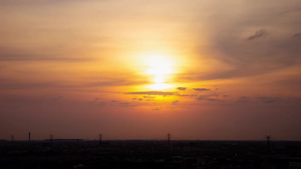 Sunrise cloudy sky time lapse on downtown cityscape building in the morning