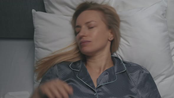 Woman Sleeping Sweet in Bed