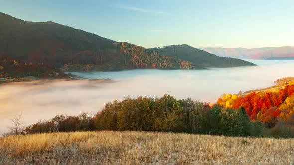 Epic Aerial Flight Over Sunrise in Autumn Mountains