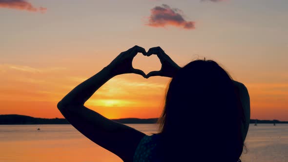 Woman At Sunset Makes A Hand Heart By Dmitriy 0412 Videohive