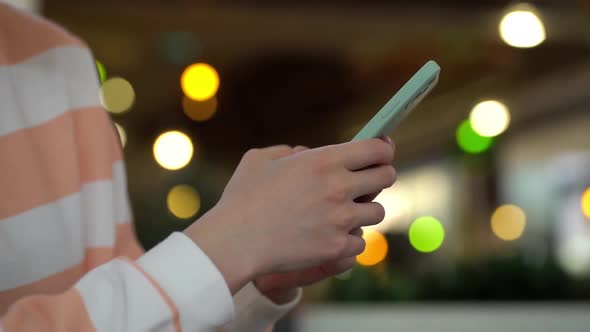 Focus on Female Hand Using Smartphone and Posting Social Media alt